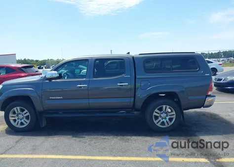2015 Toyota Tacoma Base V6 z USA, uszkodzony, nr VIN 3TMLU4EN1FM177255